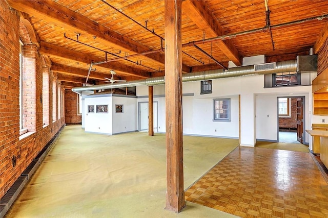 116 Chestnut St Unit G, Providence, RI 02903 - misc room with wooden ceiling with exposed beams, a ceiling fan, brick wall, and baseboards