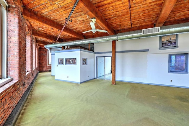 116 Chestnut St Unit G, Providence, RI 02903 - carpeted empty room featuring baseboards, wood ceiling with exposed beams, and a ceiling fan