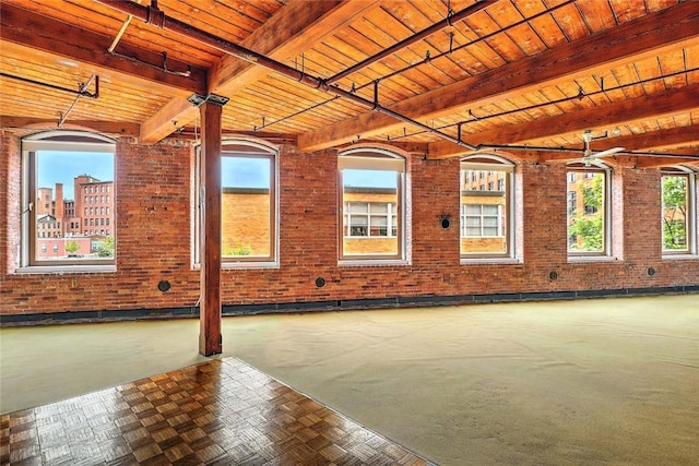 116 Chestnut St Unit G, Providence, RI 02903 - unfurnished room with brick wall and wooden ceiling with exposed beams
