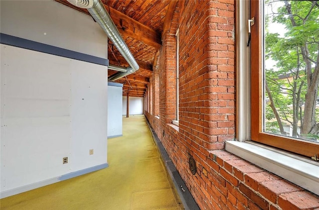 116 Chestnut St Unit G, Providence, RI 02903 - corridor featuring brick wall and baseboards