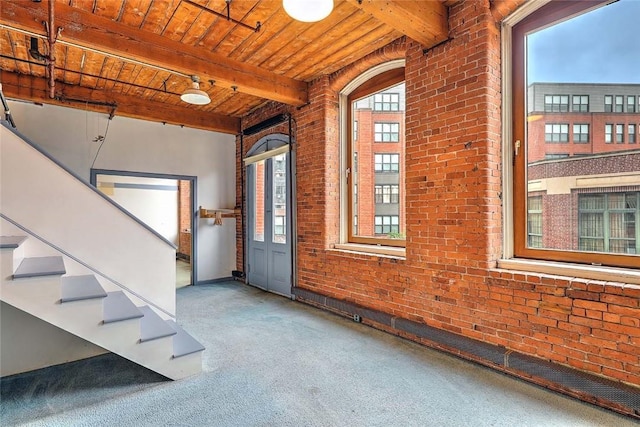 116 Chestnut St Unit G, Providence, RI 02903 - carpeted entrance foyer with wood ceiling with exposed beams, brick wall, and stairway