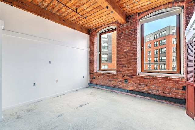 116 Chestnut St Unit G, Providence, RI 02903 - spare room with wooden ceiling with exposed beams, brick wall, and baseboards