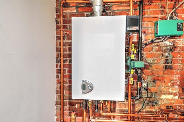 116 Chestnut St Unit G, Providence, RI 02903 - utility room featuring tankless water heater