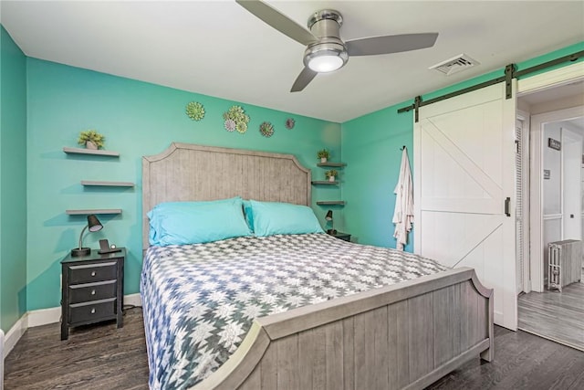 205 Carolyn St, Warwick, RI 02886 - bedroom with dark wood-style floors, a barn door, and ceiling fan