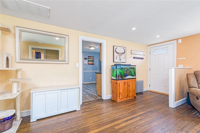 205 Carolyn St, Warwick, RI 02886 - living area featuring radiator, dark wood finished floors, and recessed lighting