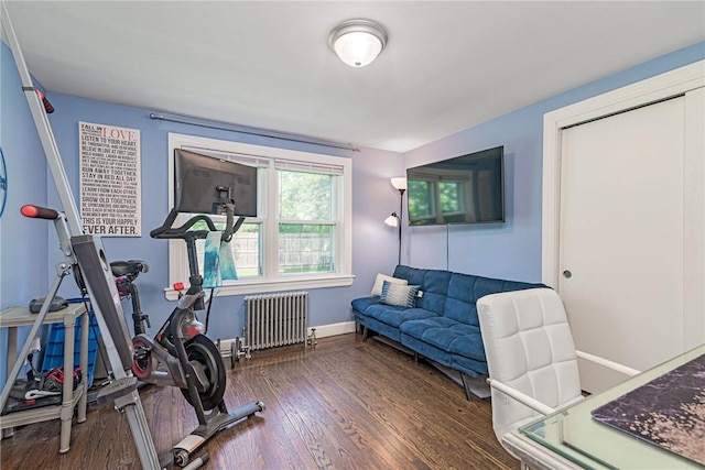 205 Carolyn St, Warwick, RI 02886 - exercise room featuring radiator heating unit and wood finished floors