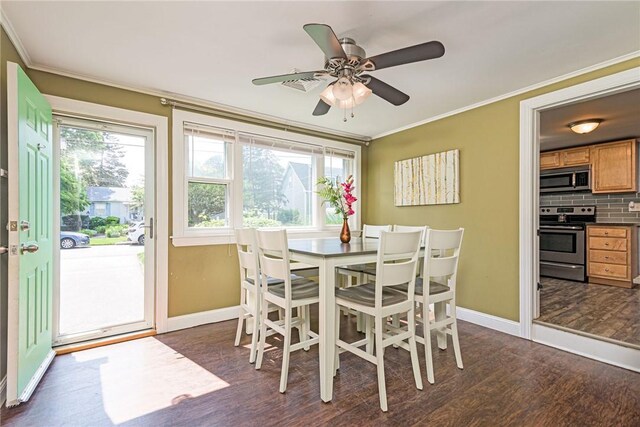 205 Carolyn St, Warwick, RI 02886 - dining space featuring crown molding, dark wood finished floors, healthy amount of natural light, and a ceiling fan