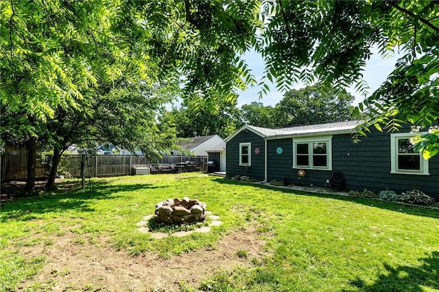 205 Carolyn St, Warwick, RI 02886 - fenced backyard with an outdoor fire pit