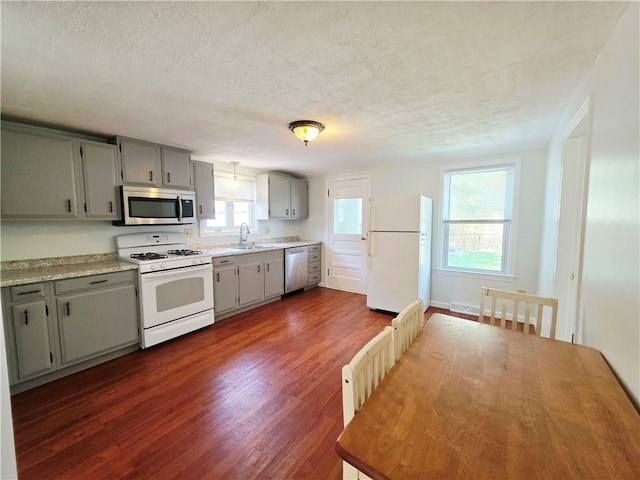 5 Rosemont Ter, North Providence, RI 02911 - kitchen featuring stainless steel appliances, a sink, gray cabinets, dark wood-style flooring, and a textured ceiling