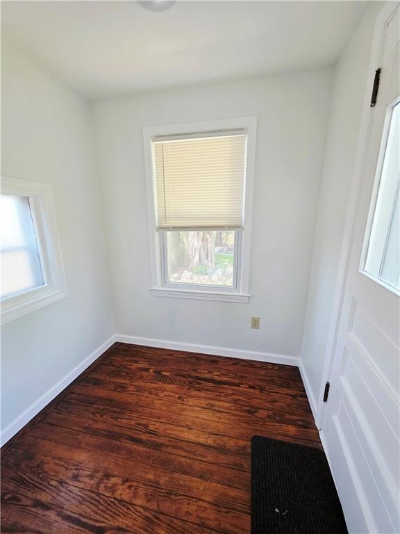 5 Rosemont Ter, North Providence, RI 02911 - empty room with wood finished floors, healthy amount of natural light, and baseboards