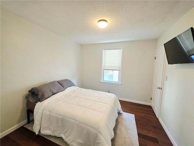 5 Rosemont Ter, North Providence, RI 02911 - bedroom with dark wood-style flooring, baseboards, and a textured ceiling