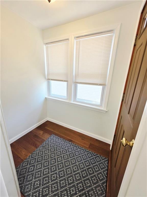 5 Rosemont Ter, North Providence, RI 02911 - unfurnished bedroom with dark wood-style flooring, a closet, and baseboards