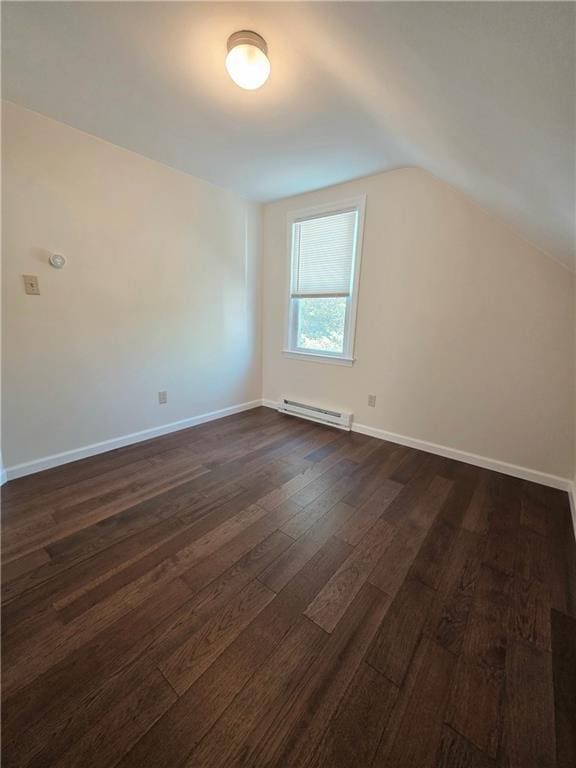 5 Rosemont Ter, North Providence, RI 02911 - bonus room with a baseboard radiator, dark wood-type flooring, lofted ceiling, and baseboards