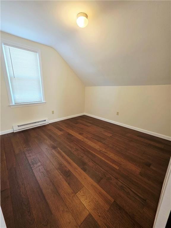 5 Rosemont Ter, North Providence, RI 02911 - bonus room featuring baseboard heating, dark wood finished floors, vaulted ceiling, and baseboards