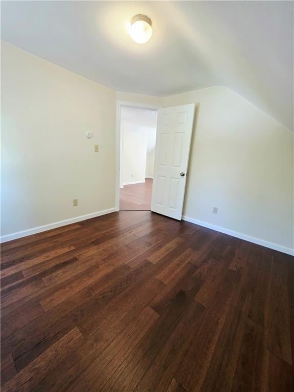 5 Rosemont Ter, North Providence, RI 02911 - additional living space with dark wood-type flooring, baseboards, and vaulted ceiling