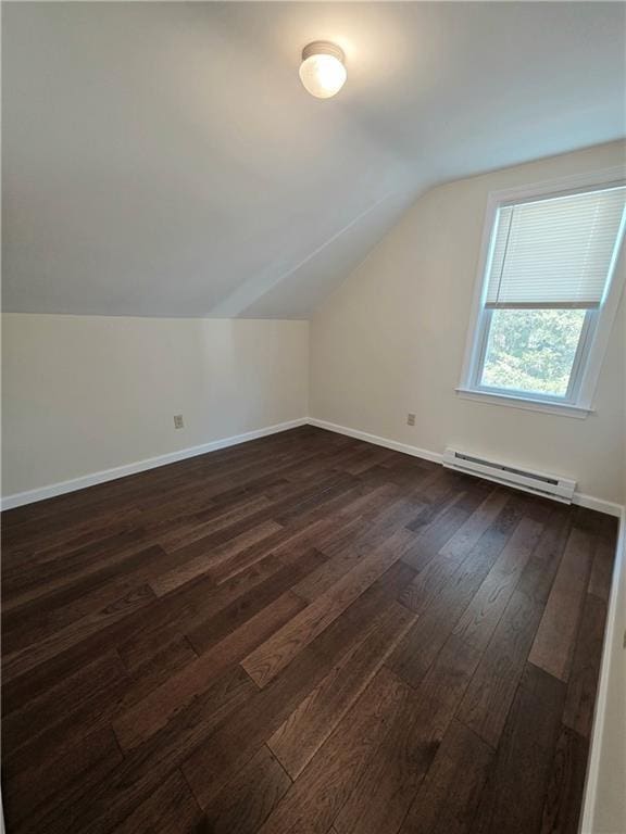 5 Rosemont Ter, North Providence, RI 02911 - additional living space with a baseboard heating unit, vaulted ceiling, dark wood-type flooring, and baseboards