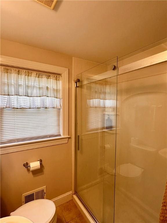 100 Benedict St, Pawtucket, RI 02861 - bathroom with toilet, a stall shower, tile patterned floors, and baseboards