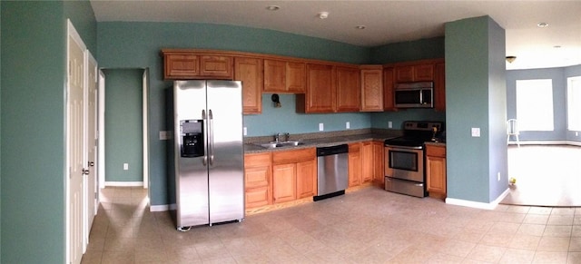 20 Vivian Ave, Cumberland, RI 02864 - kitchen with stainless steel appliances, a sink, baseboards, and light tile patterned floors