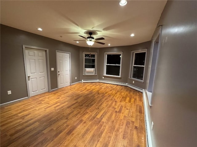 20 Vivian Ave, Cumberland, RI 02864 - empty room featuring wood finished floors, ceiling fan, recessed lighting, baseboards, and a baseboard heating unit