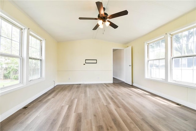 40 Lowell Ave, Pawtucket, RI 02861 - empty room featuring healthy amount of natural light, wood finished floors, a ceiling fan, lofted ceiling, and baseboards