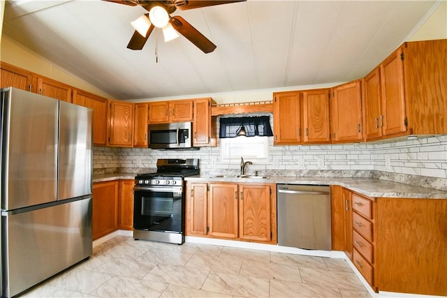 40 Lowell Ave, Pawtucket, RI 02861 - kitchen with stainless steel appliances, a sink, tasteful backsplash, light countertops, and a ceiling fan