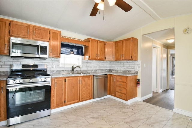 40 Lowell Ave, Pawtucket, RI 02861 - kitchen with stainless steel appliances, a sink, tasteful backsplash, ceiling fan, and lofted ceiling