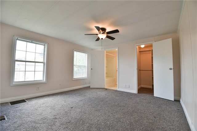 40 Lowell Ave, Pawtucket, RI 02861 - unfurnished bedroom with carpet floors, a spacious closet, ensuite bath, and baseboards