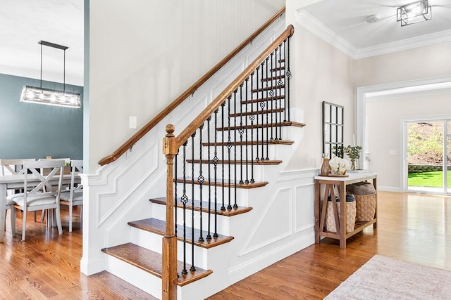 13 Vincent Way, Cumberland, RI 02864 - stairway featuring ornamental molding, wood finished floors, and a decorative wall