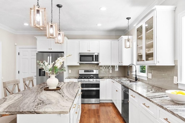 13 Vincent Way, Cumberland, RI 02864 - kitchen with stainless steel appliances, a sink, glass insert cabinets, white cabinetry, and recessed lighting