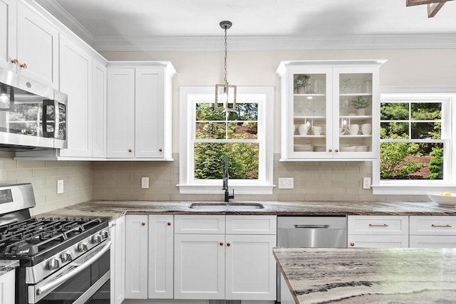 13 Vincent Way, Cumberland, RI 02864 - kitchen with stainless steel appliances, a sink, white cabinetry, plenty of natural light, and ornamental molding
