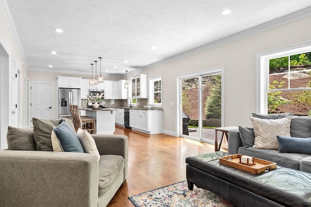 13 Vincent Way, Cumberland, RI 02864 - living room with crown molding, recessed lighting, light wood-style flooring, and a chandelier