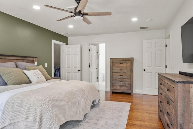 13 Vincent Way, Cumberland, RI 02864 - bedroom with light wood-type flooring, recessed lighting, ceiling fan, ensuite bathroom, and baseboards