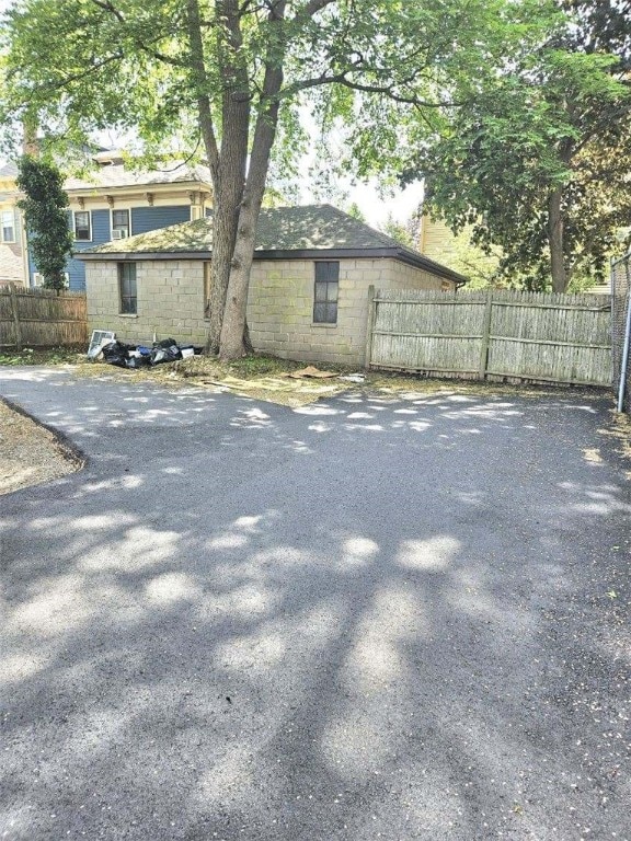 90 Grove St, Providence, RI 02903 - view of home's exterior featuring concrete block siding