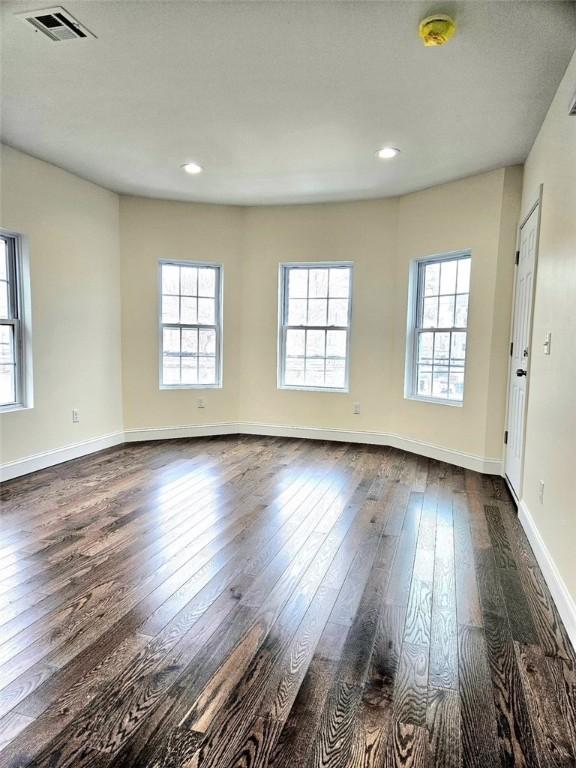 90 Grove St, Providence, RI 02903 - spare room with dark wood-style flooring, healthy amount of natural light, baseboards, a smoke detector, and recessed lighting