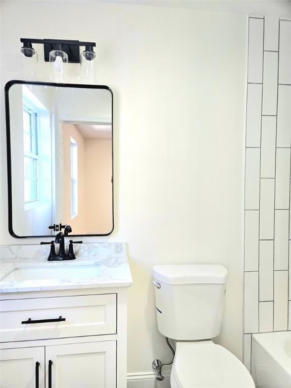 90 Grove St, Providence, RI 02903 - full bathroom with toilet, vanity, baseboards, and bathing tub / shower combination