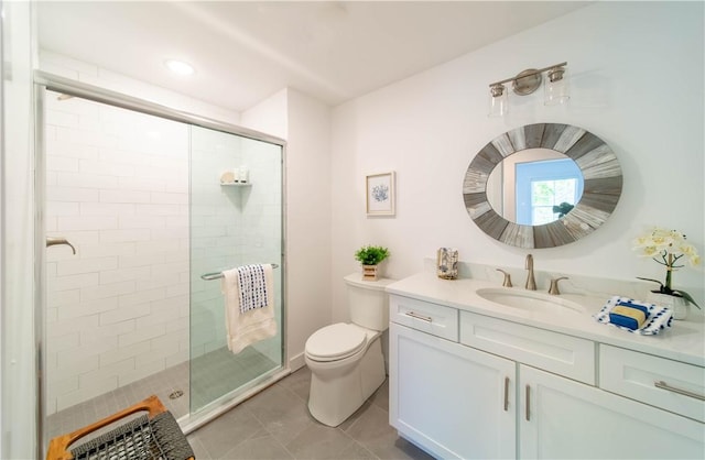 32 Exchange St Unit 104, East Greenwich, RI 02818 - bathroom featuring a shower stall, vanity, toilet, and tile patterned floors