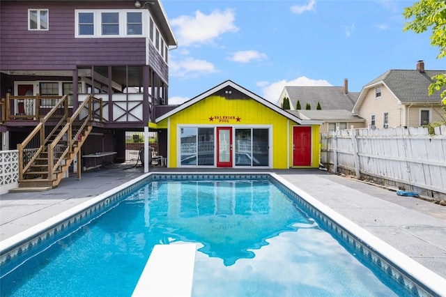 204 Reservoir Ave, Lincoln, RI 02865 - view of pool with a diving board, an outbuilding, stairs, a patio area, and a deck