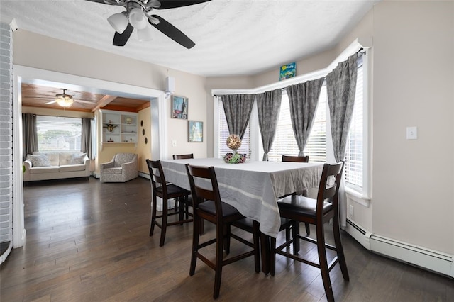 204 Reservoir Ave, Lincoln, RI 02865 - dining room featuring a ceiling fan, a baseboard radiator, and dark wood-style flooring