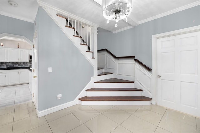 204 Reservoir Ave, Lincoln, RI 02865 - stairway featuring a chandelier, crown molding, and tile patterned floors
