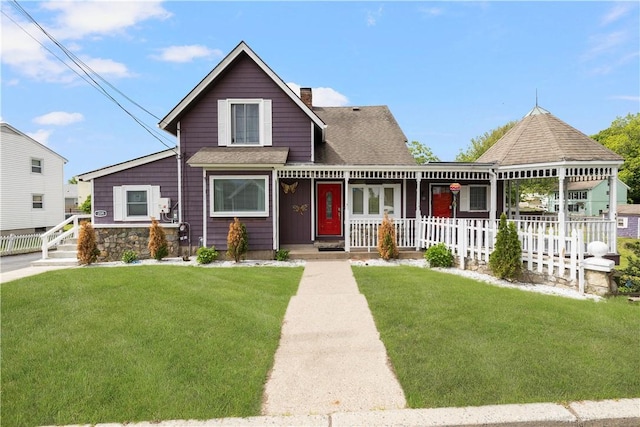 204 Reservoir Ave, Lincoln, RI 02865 - view of front of home with a porch, a chimney, a front yard, and a shingled roof