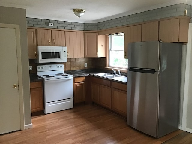 2073 Plainfield Pike, Johnston, RI 02919 - kitchen with white appliances, a sink, dark countertops, light wood finished floors, and decorative backsplash