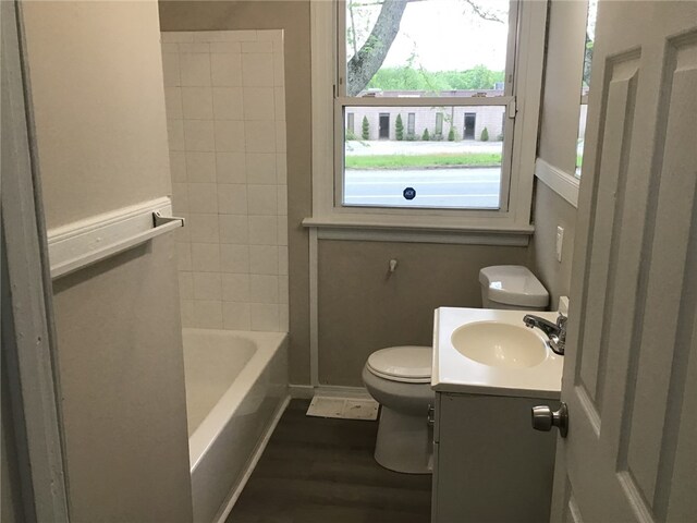 2073 Plainfield Pike, Johnston, RI 02919 - full bath featuring toilet, wood finished floors, vanity, and baseboards