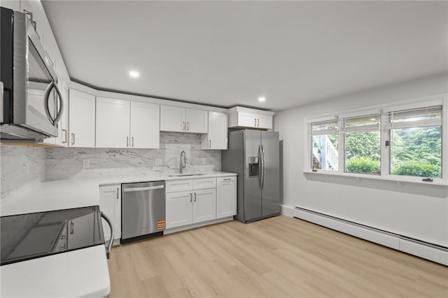 196 Stillwater Rd, Smithfield, RI 02917 - kitchen with appliances with stainless steel finishes, a baseboard radiator, a sink, white cabinetry, and recessed lighting