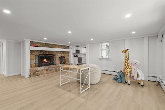 196 Stillwater Rd, Smithfield, RI 02917 - living area featuring a fireplace, light wood finished floors, a baseboard heating unit, recessed lighting, and baseboards