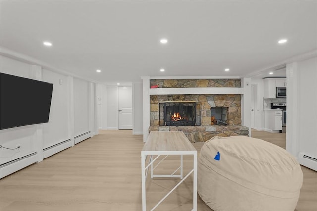 196 Stillwater Rd, Smithfield, RI 02917 - living area featuring light wood-type flooring, a fireplace, recessed lighting, and a baseboard heating unit