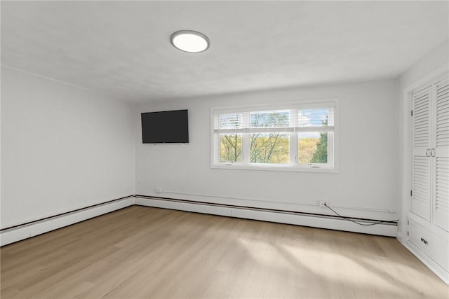 196 Stillwater Rd, Smithfield, RI 02917 - unfurnished bedroom featuring light wood-style floors and baseboard heating