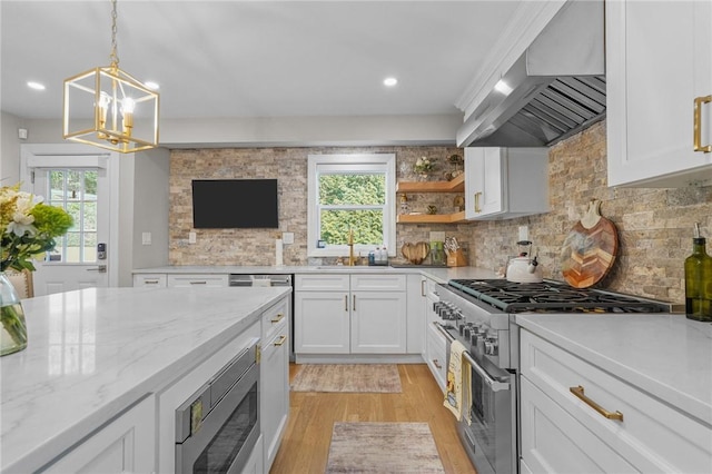 196 Stillwater Rd, Smithfield, RI 02917 - kitchen with wall chimney exhaust hood, stainless steel appliances, light wood finished floors, white cabinets, and tasteful backsplash