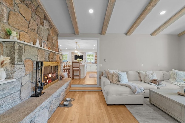 196 Stillwater Rd, Smithfield, RI 02917 - living room featuring wood finished floors, beamed ceiling, recessed lighting, and a fireplace