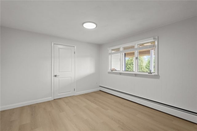 196 Stillwater Rd, Smithfield, RI 02917 - unfurnished room featuring baseboard heating, light wood finished floors, and baseboards