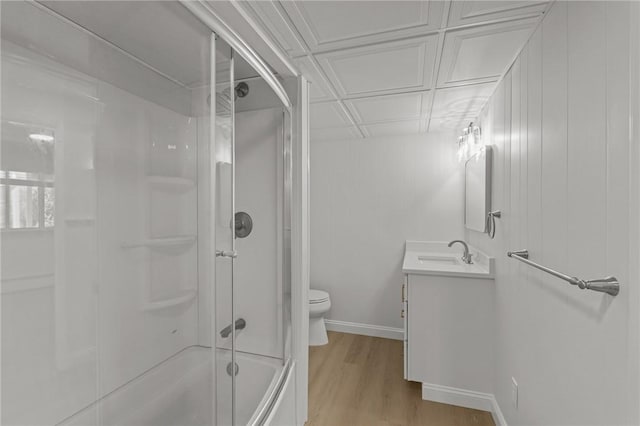 196 Stillwater Rd, Smithfield, RI 02917 - bathroom with vanity, toilet, wood finished floors, bath / shower combo with glass door, and an ornate ceiling